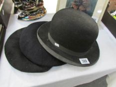 A bowler hat and 2 berets
