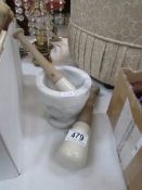 A marble pestle and 2 mortars