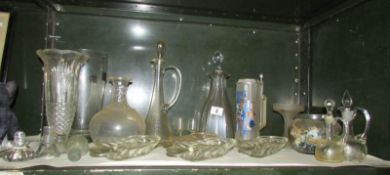 A shelf of glass ware