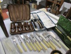 A cased carving set, cased fish servers, cased grapefruit set and fish knives and forks,