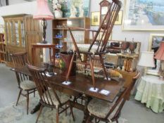 An oak draw leaf table and 6 chairs