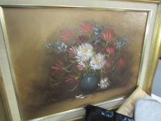 A gilt framed floral study