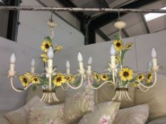 A pair of wrought metal floral ceiling lights