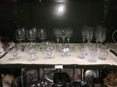 A shelf of glass ware