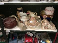 A shelf of miscellaneous including jug and basin sets,