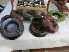 A quantity of bakelite ashtrays