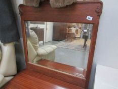 A wood framed bevel edged mirror