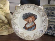 A hand painted cabinet plate