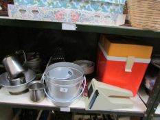 A shelf of kitchen ware