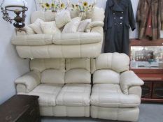 A 2 seat and a 3 seat cream leather sofas