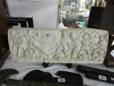 A plaster panel depicting Roman soldiers