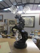 A figural table lamp featuring rampant horse with glass shades