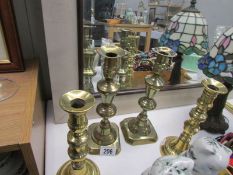 2 pairs of brass candlesticks