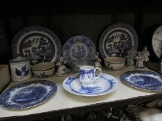 A shelf of blue and white china etc