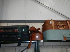 A quantity of suitcases etc.