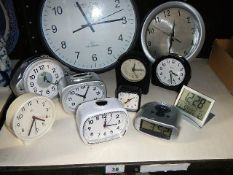 A quantity of wall & alarm clocks etc.