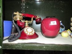 A vintage style telephone and a vase