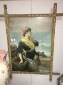 A framed and glazed Victorian print of lady on beach