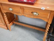 A pine 2 drawer side table