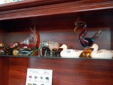 A shelf of birds,