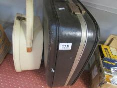 A suitcase and a vanity case