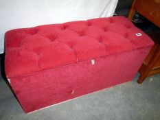 A pink ottoman