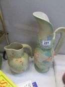 A tall Winchester pottery ewer and a Denham pottery jug
