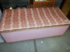 A pink ottoman