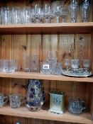 3 shelves of art glass including clock
