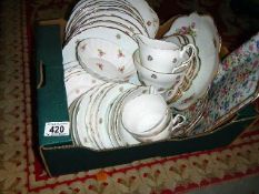 A box of china cups & plates