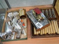 A shelf of cutlery etc.