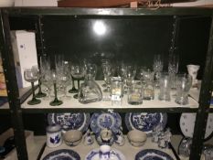 A shelf of glass ware