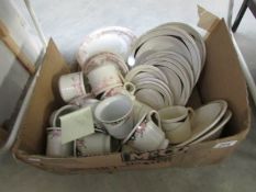 A box of assorted tea ware