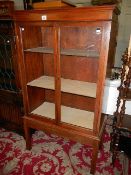 A mahogany display cabinet