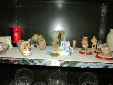 A shelf of animal figures etc