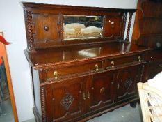 An oak mirror backed sideboard