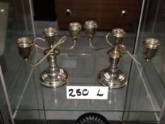 A pair of silver plated candelabras