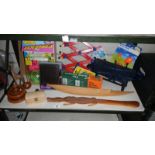 A shelf of miscellaneous including wooden crocodile, wooden items,