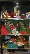 3 shelves of Christmas decorations and items