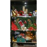 3 shelves of Christmas decorations and items