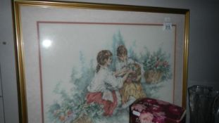 An embroidered picture of girls in garden