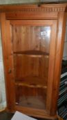 A pine corner cupboard