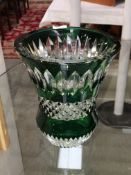 A glass vase with green overlay