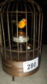 A bird in cage clock