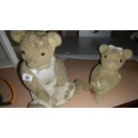 2 garden teddy bears