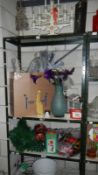 3 shelves of Christmas decorations and items