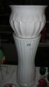 A white jardiniere on stand