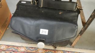 An old Dell laptop and Dell satchel case