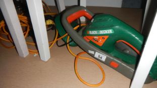 A Black and Decker hedge trimmer