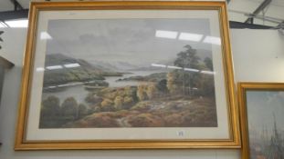 A large gil framed and glazed picture of hil and lake scene with sheep farmer